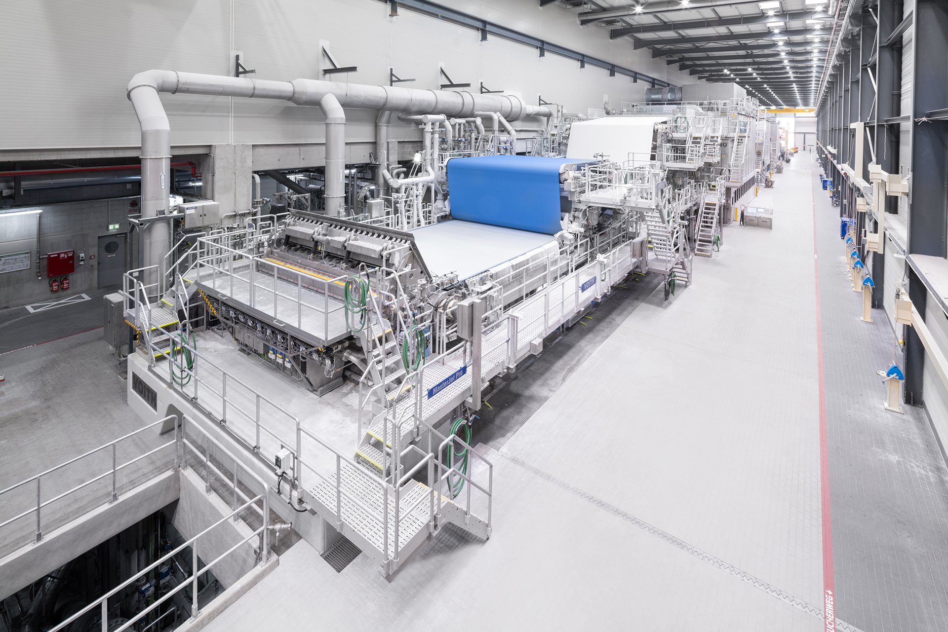 Paper machine in an industrial building
