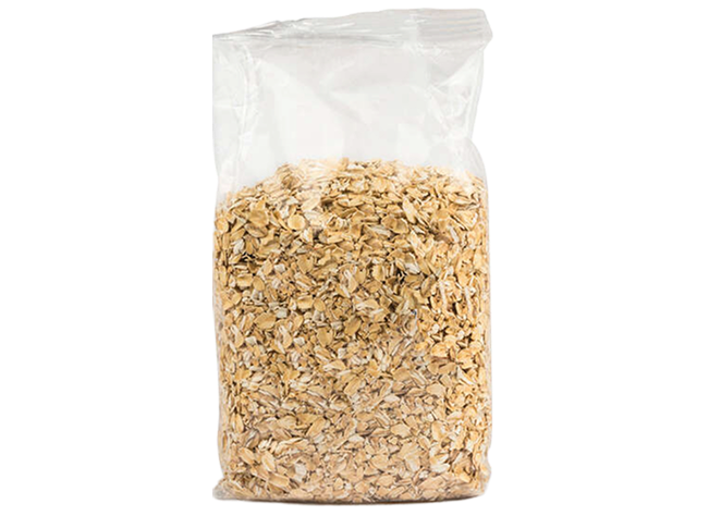 Clear bag filled with oat flakes isolated on a neutral background for product focus