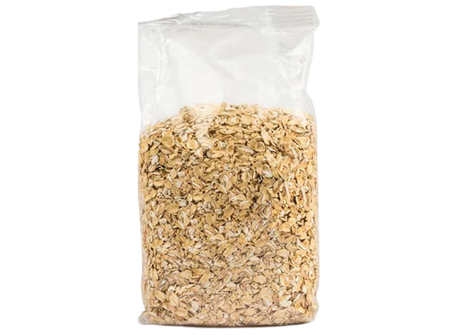 Clear bag filled with oat flakes isolated on a neutral background for product focus